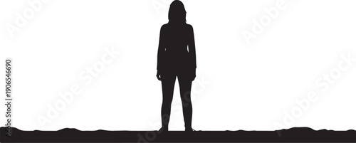 Silhouette of a woman standing alone on a cliff edge