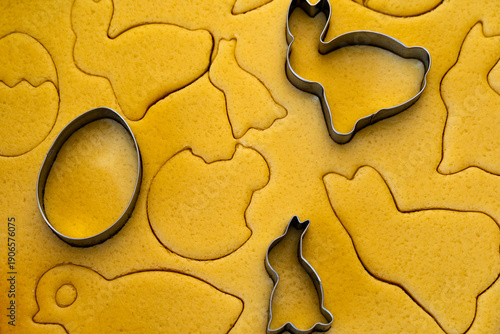 Easter cookie crafting involves creating festive treats by cutting shortcrust dough into traditional shapes like bunnies, eggs, and chicks using special cookie cutters, following detailed traditional 