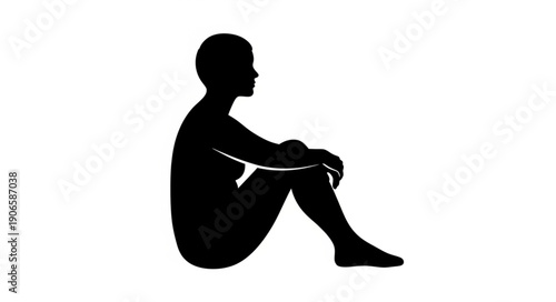 Silhouette of a person sitting with knees drawn up.