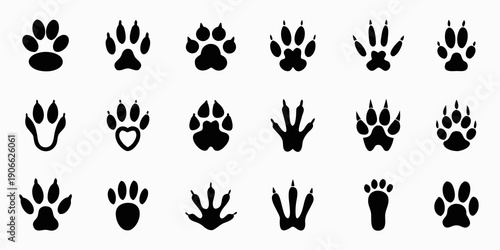 Collection of various black animal paw prints arranged in rows