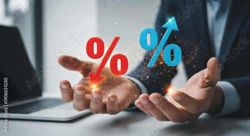 Close up of a persons hand holding percentage signs, representing interest rates and financial growth