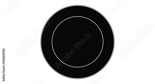 A stark black circular shape dominates the frame with a thinner white circle within creating a simple silhouette high quality professional