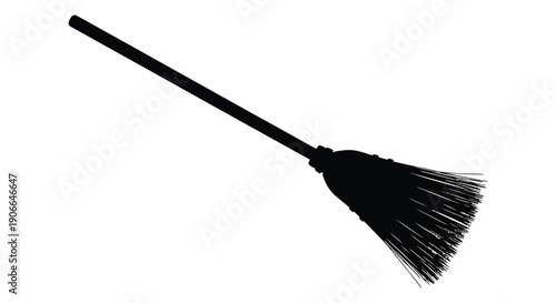 A simple black silhouette of a traditional witch s broom against a stark white background emphasizing its form silhouette high quality professional