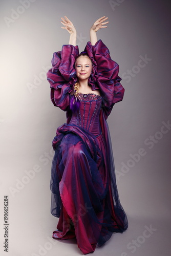 Graceful Girl in Dramatic Purple Fantasy Gown
