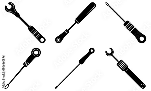 Collection of various wrenches and screwdrivers arranged neatly on a plain background