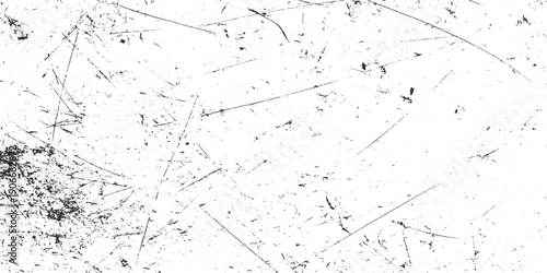 Black and white textured background with numerous fine scratches and speckles abstract