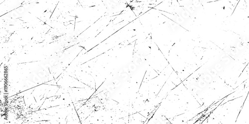 Black scratches and speckles on a white textured background grunge