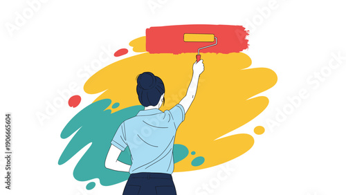 Creative woman from back view paints a yellow wall with a bright red horizontal stripe using a long handle paint roller.