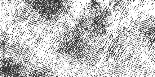 Black and white diagonal textured pattern with irregular speckles and smudges