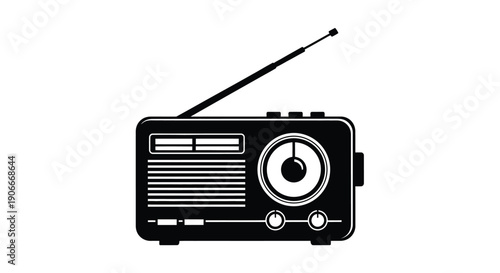 Vintage radio with extended antenna a stark black silhouette