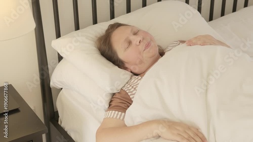 Woman suffering from insomnia lying awake in wooden bed, feeling anxious and restless, struggling to fall asleep due to stress and tension, symbol of mental fatigue and sleepless, falling asleep