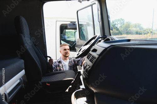 Картината върху платно Man truck driver entering cabin ready working