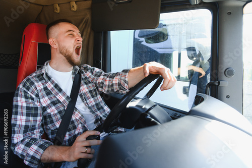 Cuadro en lienzo Truck driver yawning experiencing fatigue driving vehicle