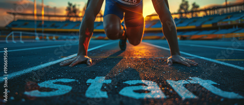 Athlete runner in starting position on athletics track at sunrise with focus and determination. Sports training scene symbolizing motivation to start new year 2026, goal setting, new beginning.
