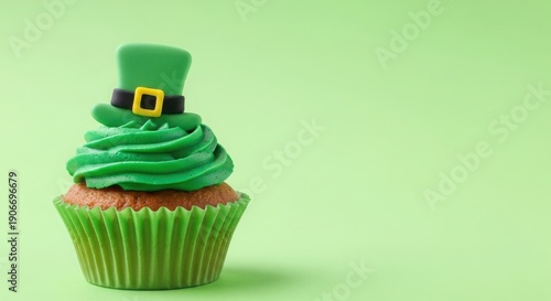 A cupcake with green frosting and a tiny leprechaun hat on top for St. Patrick's Day