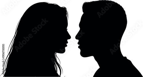 Romantic silhouette of a young man and woman profile facing each other in a close intimate moment for love and romance