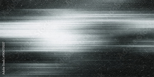 Abstract silver brushed metal background featuring a shiny stainless steel texture pattern with dark grey rays and metallic lines on a polished aluminum surface backdrop