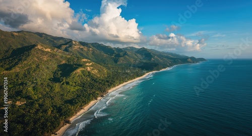 Wallpaper Mural Aerial photography showing rich green hills next to turquoise ocean waves in a peaceful landscape Torontodigital.ca