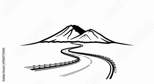 A winding road leads towards a majestic mountain peak under a clear sky