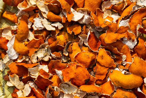 Vibrant pile of orange citrus dried peels