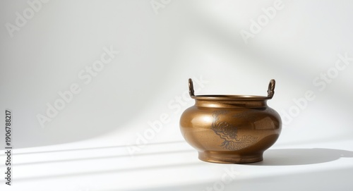 Bronze Chinese Ding pot used historically for cooking shown on white background