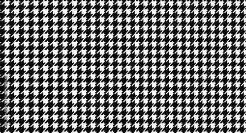 Continuous black and white dogstooth plaid design for fabric and paper prints