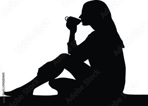 Silhouette of a woman sitting and drinking from a cup