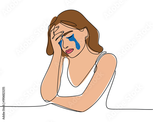 A sad woman crying with blue tears wiping her face with her hand