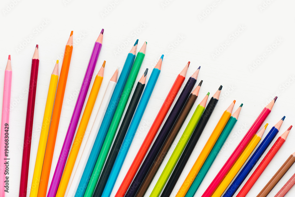 Fototapeta premium Colored pencils on a white background. Background of multicolored pencils.