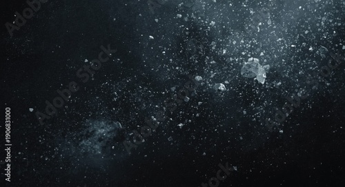 Dark base with whitish dust and flying small rocky fragments