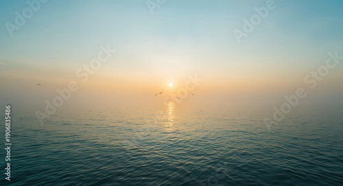 Beautiful sunrise over calm sea waters in the early morning light
