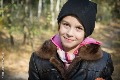 Portrait of laughing young girl in a park