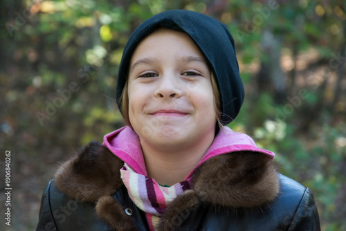 Portrait of laughing young girl in a park
