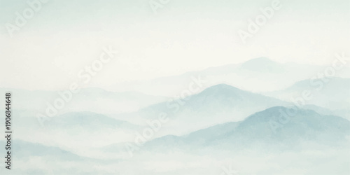 A breathtaking nature landscape features misty clouds and fog drifting over snow-capped mountains at sunset as the golden sun dips below the horizon to reveal a serene valley view