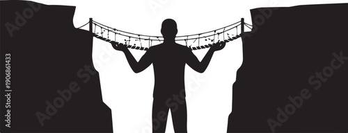 Man holding bridge between two cliffs in silhouette form