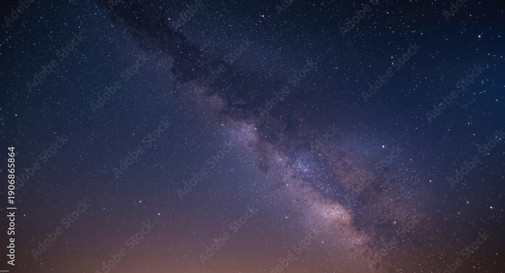 Fototapeta premium Detailed long exposure sky photo displaying Milky Way with star clusters and dusty space ambiance