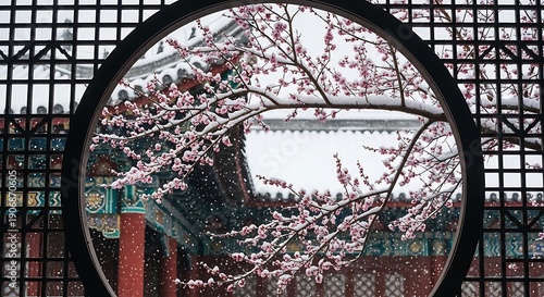 Wallpaper Mural Cherry blossoms in bloom viewed through a circular window frame against traditional architecture Torontodigital.ca