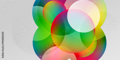 Abstract colorful circles overlap, creating vibrant gradients. Soft background enhances visual impact. Modern design element.