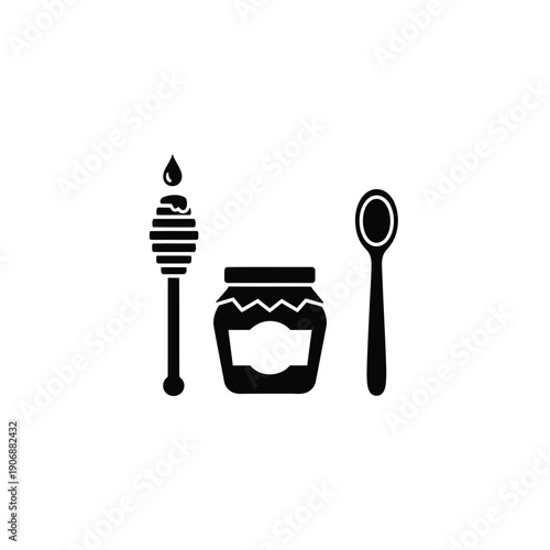 Honey jar with wooden dipper and spoon set representing sweet organic food product and traditional kitchen utensils set
