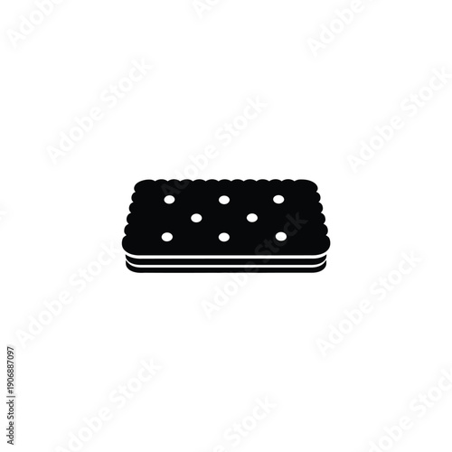 Sandwich cookie with cream filling, viewed from side, showing layers and dotted pattern