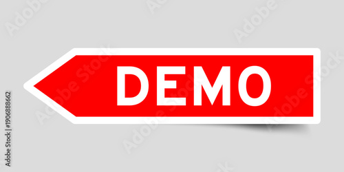 Red color arrow shape sticker label with word demo on gray background