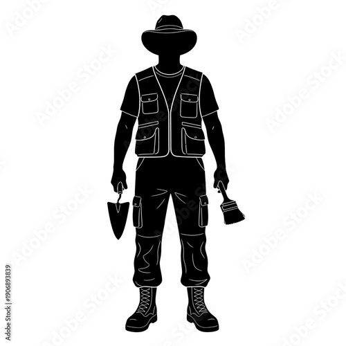 Silhouette of an Archaeologist Holding Tools Ready for Excavation.