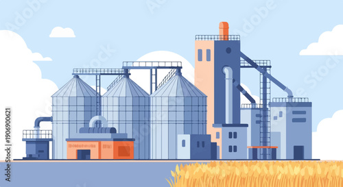 Industrial facility with grain silos, processing towers, and wheat field