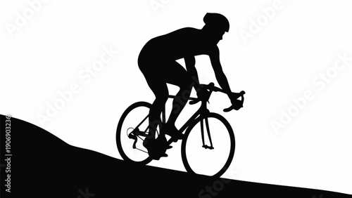 Cyclist riding uphill with intense effort and determination