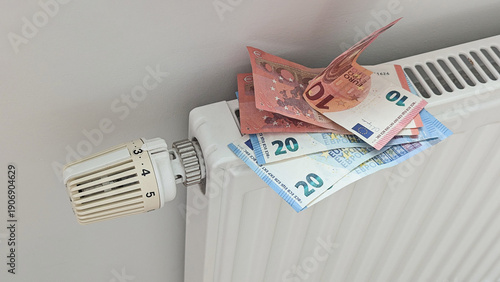Wallpaper Mural Radiator stacked with euro banknotes signals crisis in Europe winter, crisis hits household budgets, crisis mood fuels news visuals for energy projects, inflation reports Torontodigital.ca