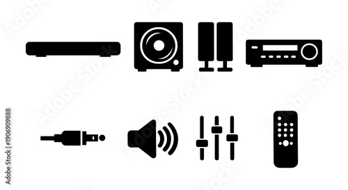 Home theater system components: subwoofer, speakers, amplifier, cables, controls