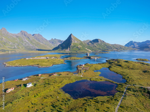 Aerial view near Fredvang with a view of the Fredvang Bridges and the distinctive peak of Volandstind. Lofoten, Norway