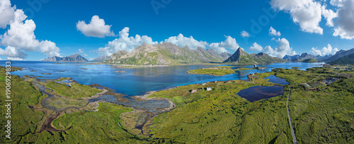 Aerial view near Fredvang with a view of the Fredvang Bridges and the distinctive peak of Volandstind. Lofoten, Norway