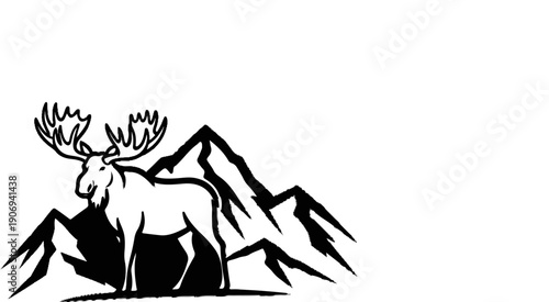 Majestic moose stands tall amidst jagged mountain peaks in a stark silhouette