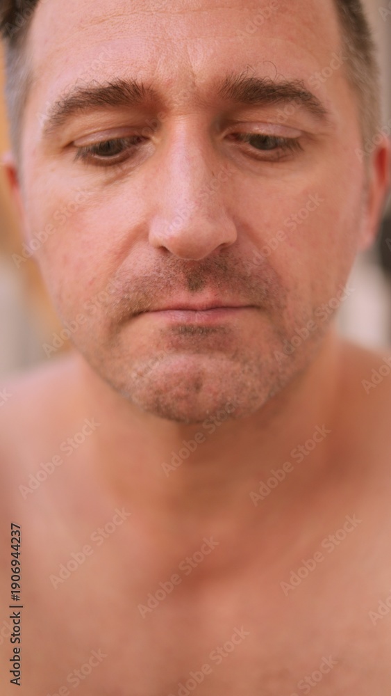 Obraz premium Vertical photo Person concentrates on chin hair while looking into mirror during morning calm, Man attentively examines his facial stubble in mirror as peaceful morning surrounds him temporarily